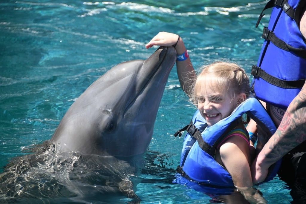 Wish Kid Caroline meeting a dolphin