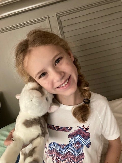 Wish kid Holin posing with dog