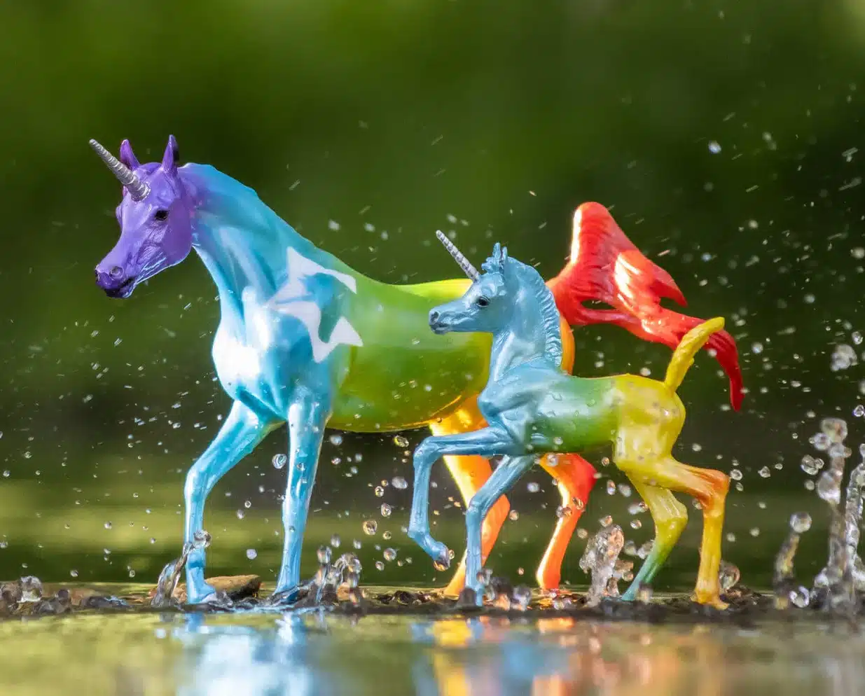 Pair of rainbow unicorn toys