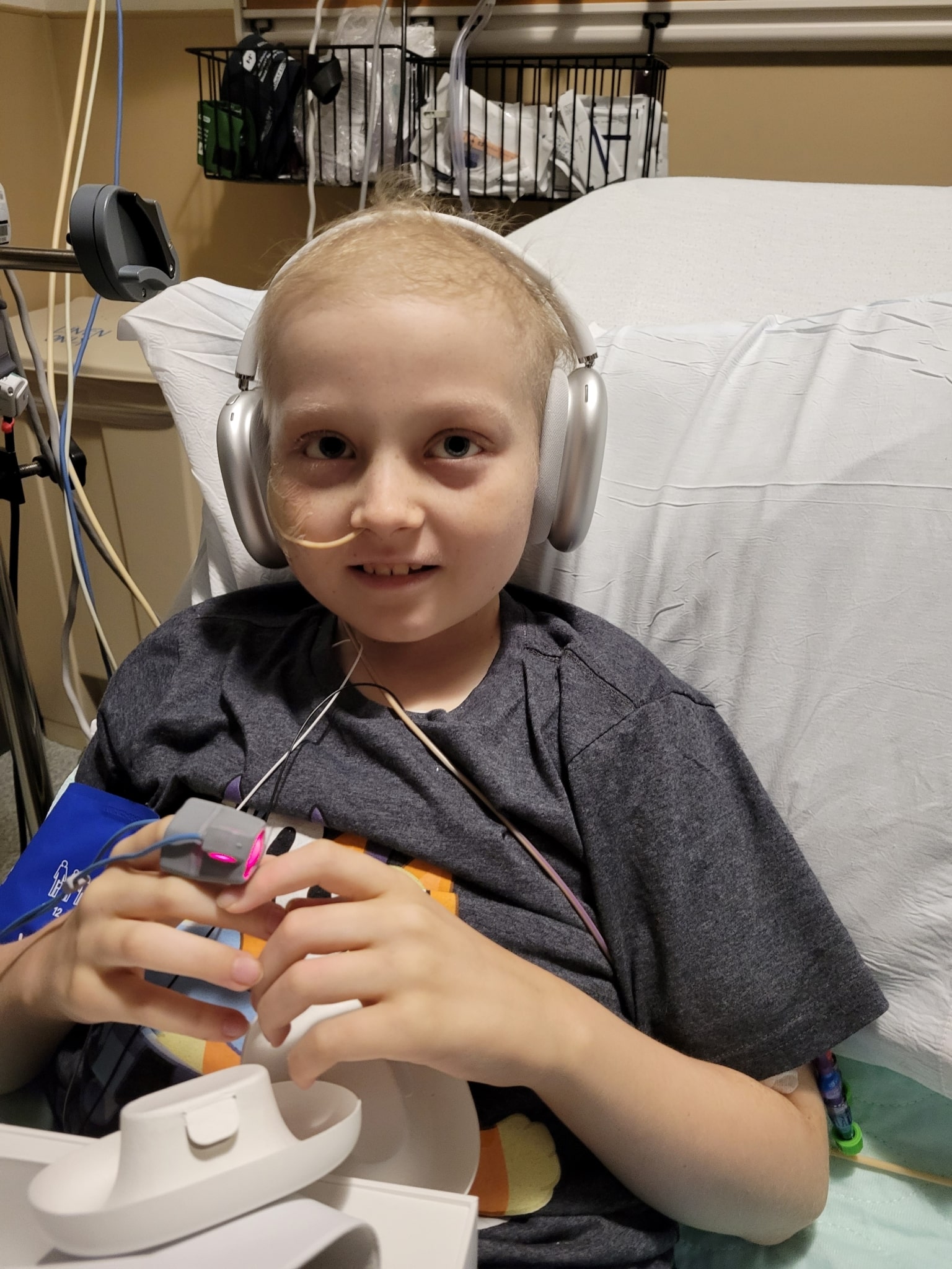 Wish kid Damien with his new toys