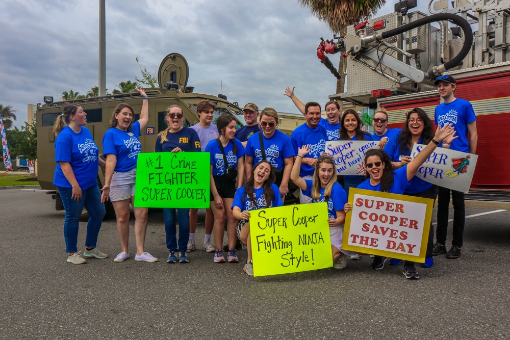 Volunteers cheering for Wish Kid Super Cooper