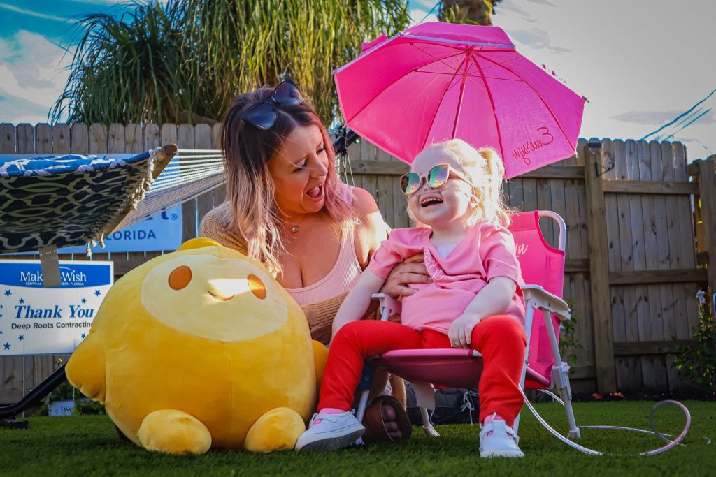 Wish Kid Emersyn enjoying her new backyard oasis