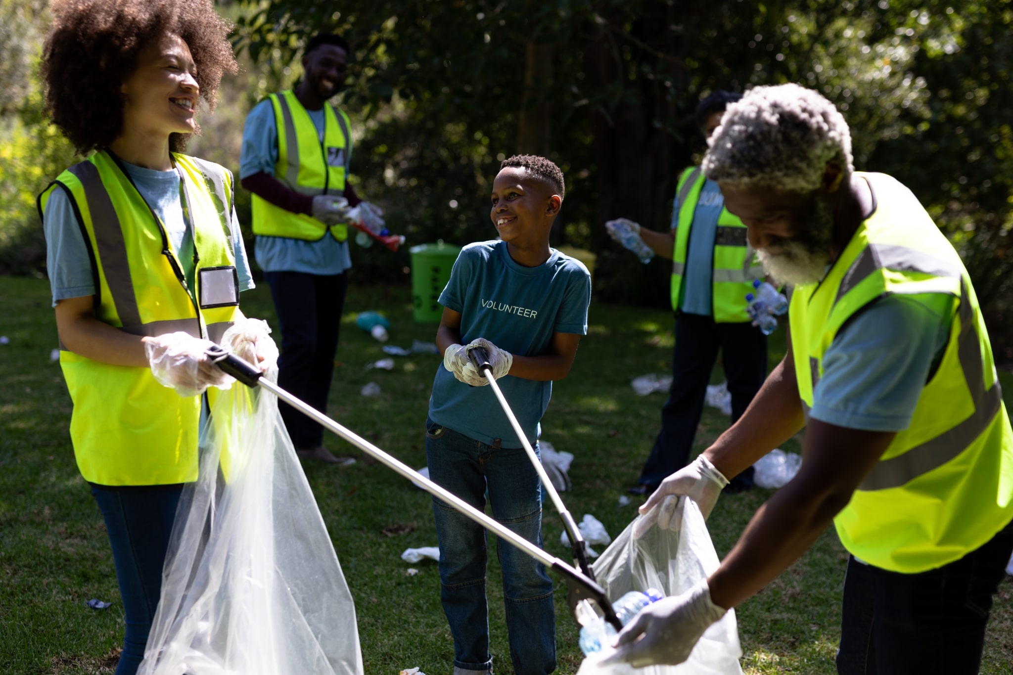 family cleaning up local park