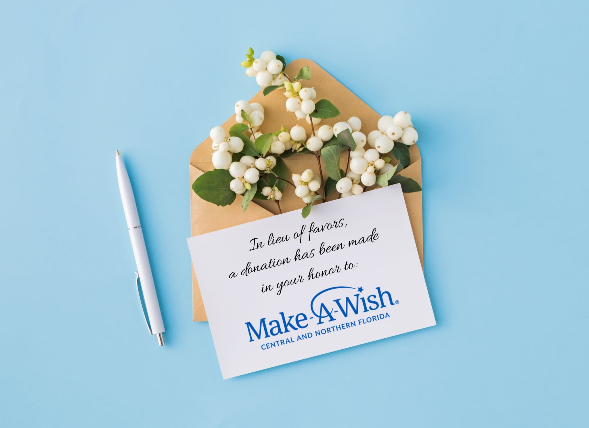 Flatlay of "in honor of" card for charity wedding favor