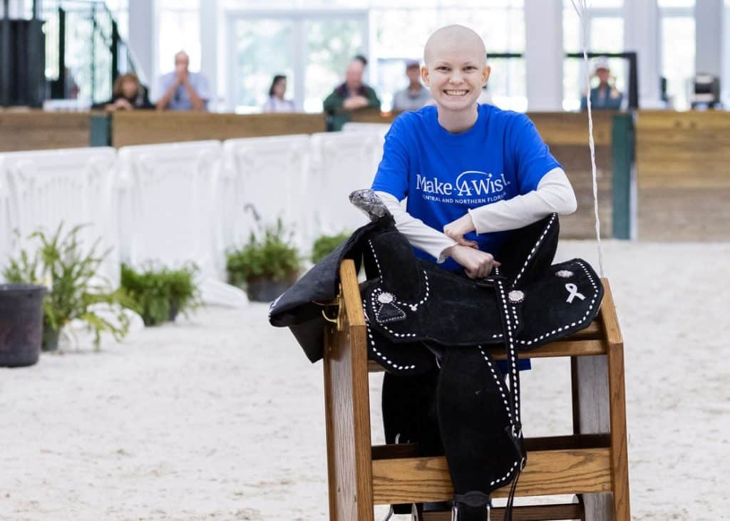 Wish Kid Kylee with her new custom horse saddle